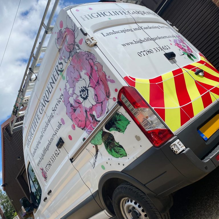 White van with pink floral graphics, Highcliffe Gardeners lettering and rear chevrons