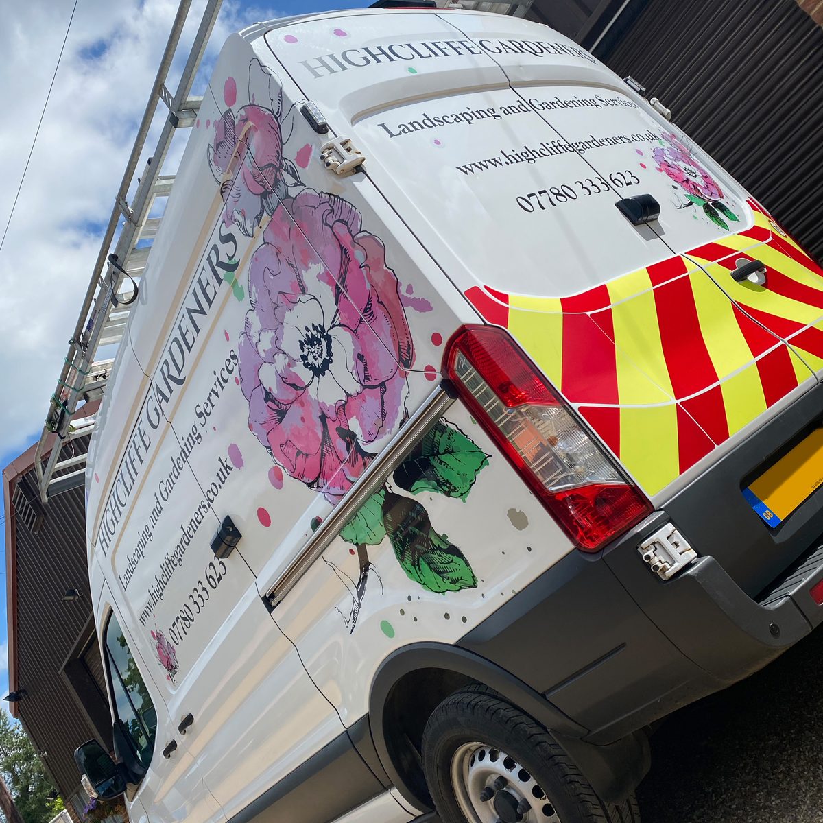 White van with pink floral graphics, Highcliffe Gardeners lettering and rear chevrons