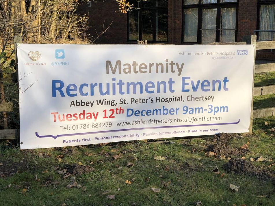 PVC banner for a maternity recruitment event at St Peter's Hospital, Chertsey, fixed to a fence