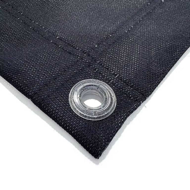 Close-up of a black mesh banner hem with a clear eyelet