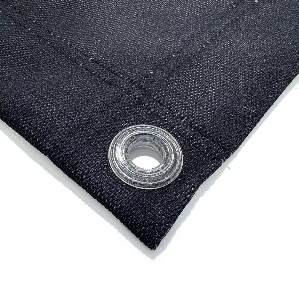 Close-up of a black mesh banner hem with a clear eyelet
