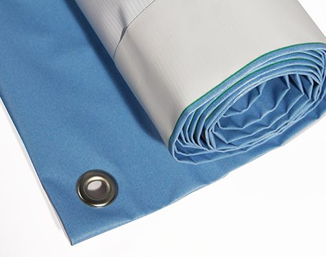 Rolled PVC banner showing hemmed edge and metal eyelet