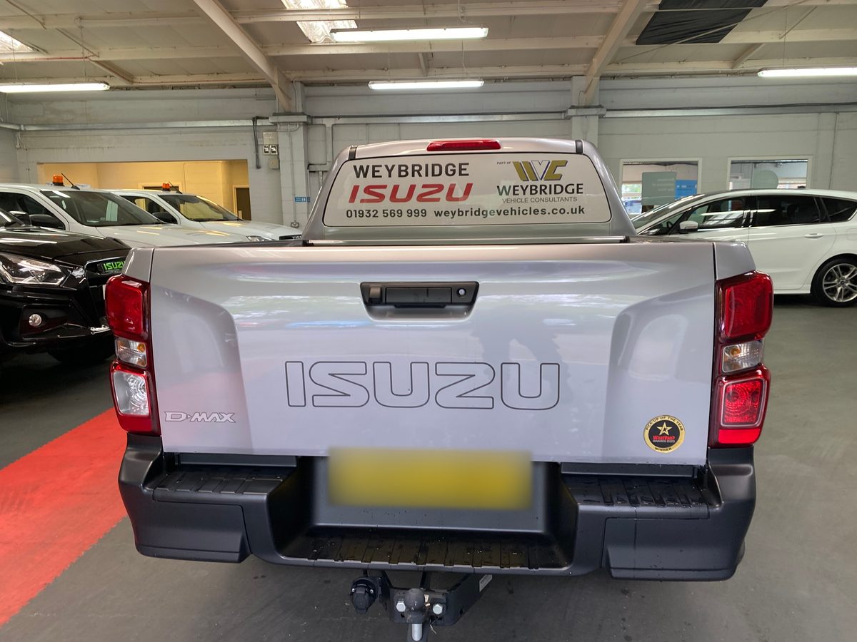 Silver Isuzu D-Max pickup with Weybridge Isuzu rear window graphic and phone number