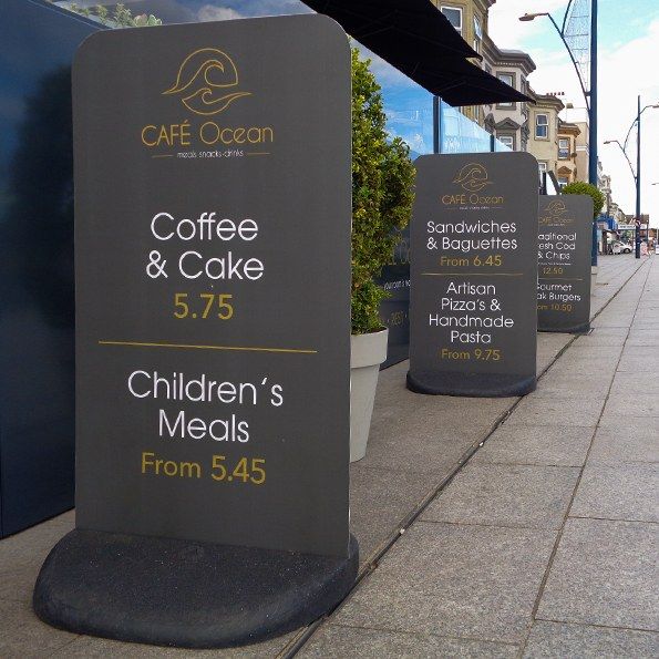 Three Ecoflex pavement signs outside a restaurant