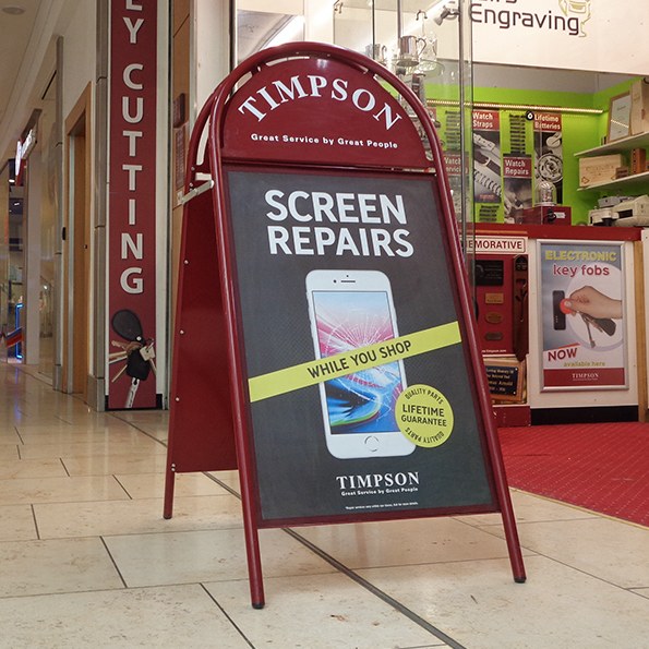 Booster pavement sign in a shopping centre
