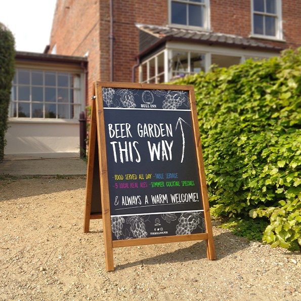 Wooden chalk A-board outside a pub