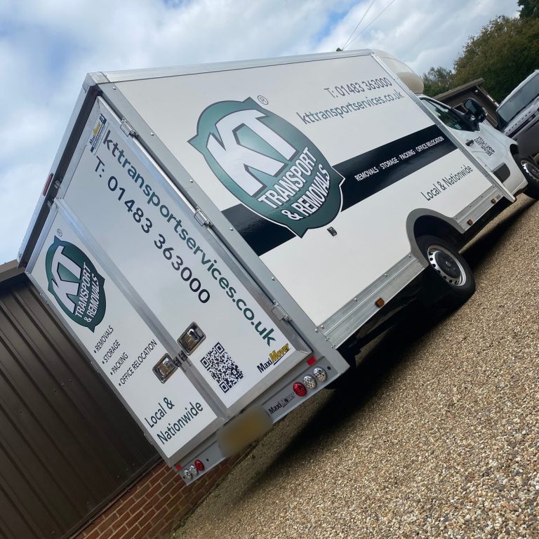 White Luton box van with KT Transport & Removals logo, phone number, QR code and web address on the side and rear